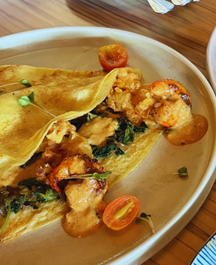 Shore to Please savory crepe with tiger prawns, squid, spinach, and tomatoes
