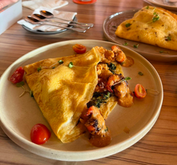 Hen’s Crush crepe with hash brown and salad, plated at Strangers at 47