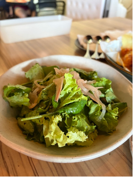 Fresh green salad with balsamic dressing at Strangers at 47